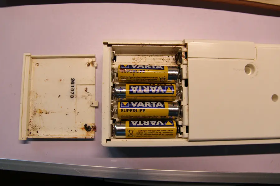 Casio VL-5 battery compartment with acid-leaked batteries